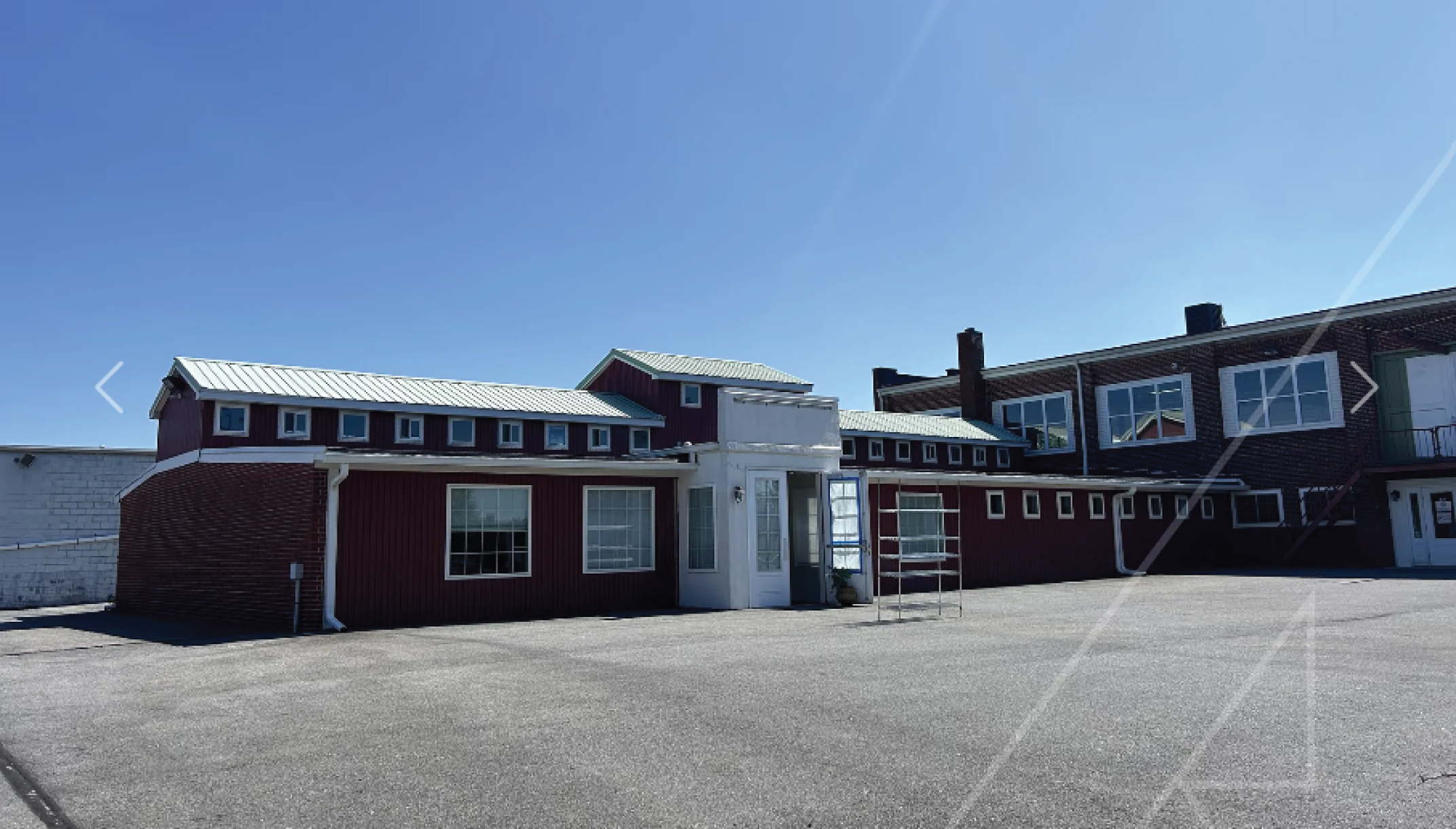 The Clubhouse Living facility — a welcoming red brick building